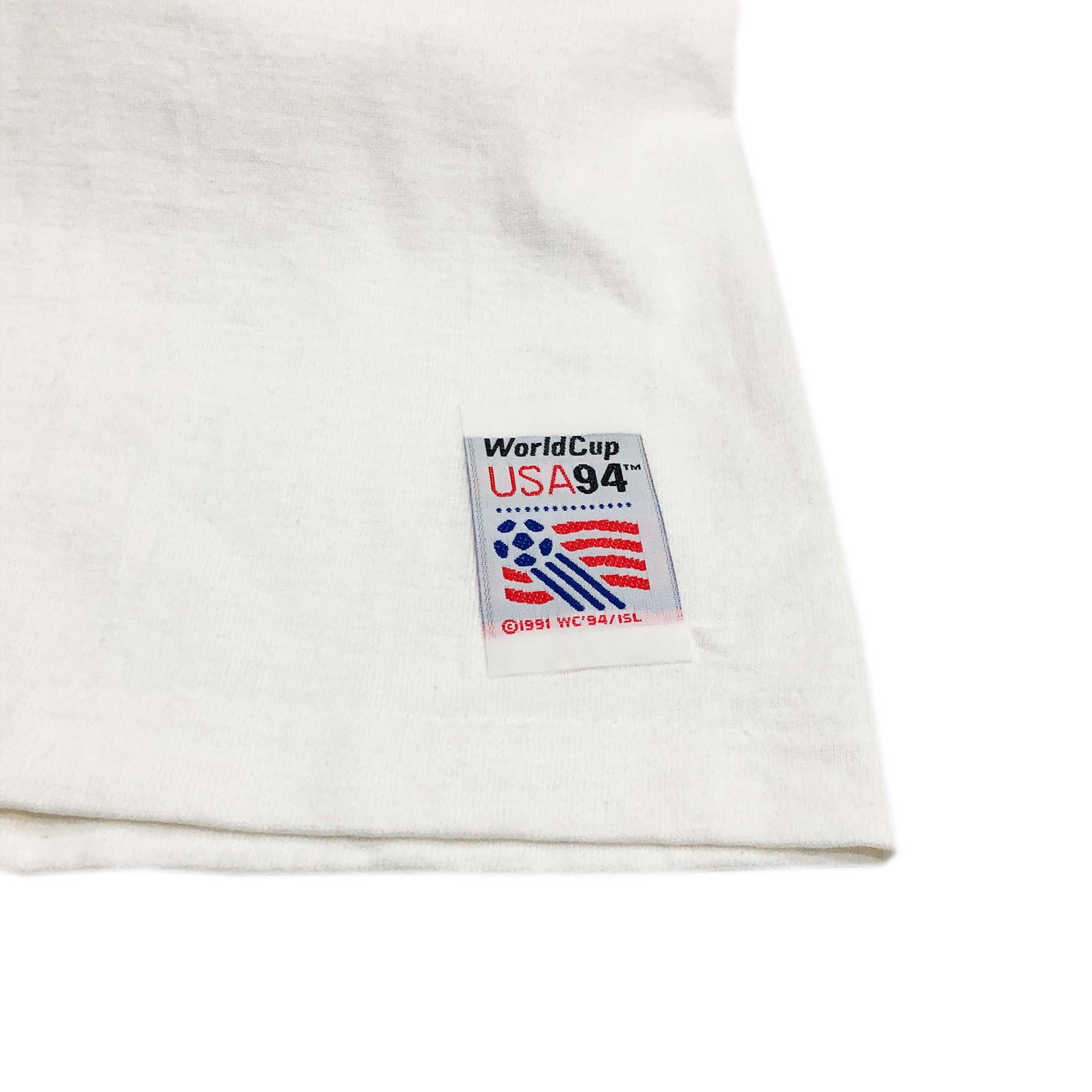 90s SALEM SPORTWEAR "Peter Max" Tシャツ 表記M ブランドタグ 白Tシャツの袖口にある「WorldCup USA94」のタグ