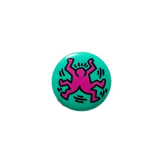 Keith Haring Old Badge 平置き 青緑色 ピンクのキース・ハリンガ描き 黒の線