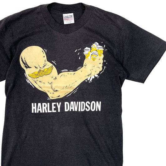 80s ONEITA Harley Davidson T L 平置き 1 黒ベースに黄色の筋肉のイラストと「HARLEY DAVIDS