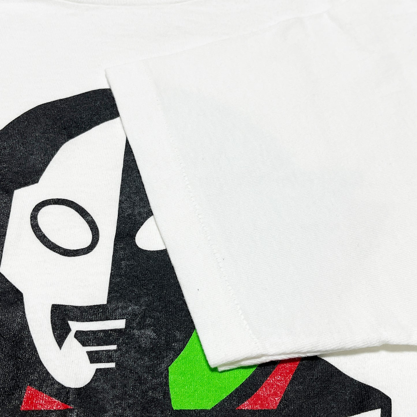90s Allsport ULTRAMAN T L ディテール ULTRAMANロゴの顔の下半分 黒・白・緑の配色