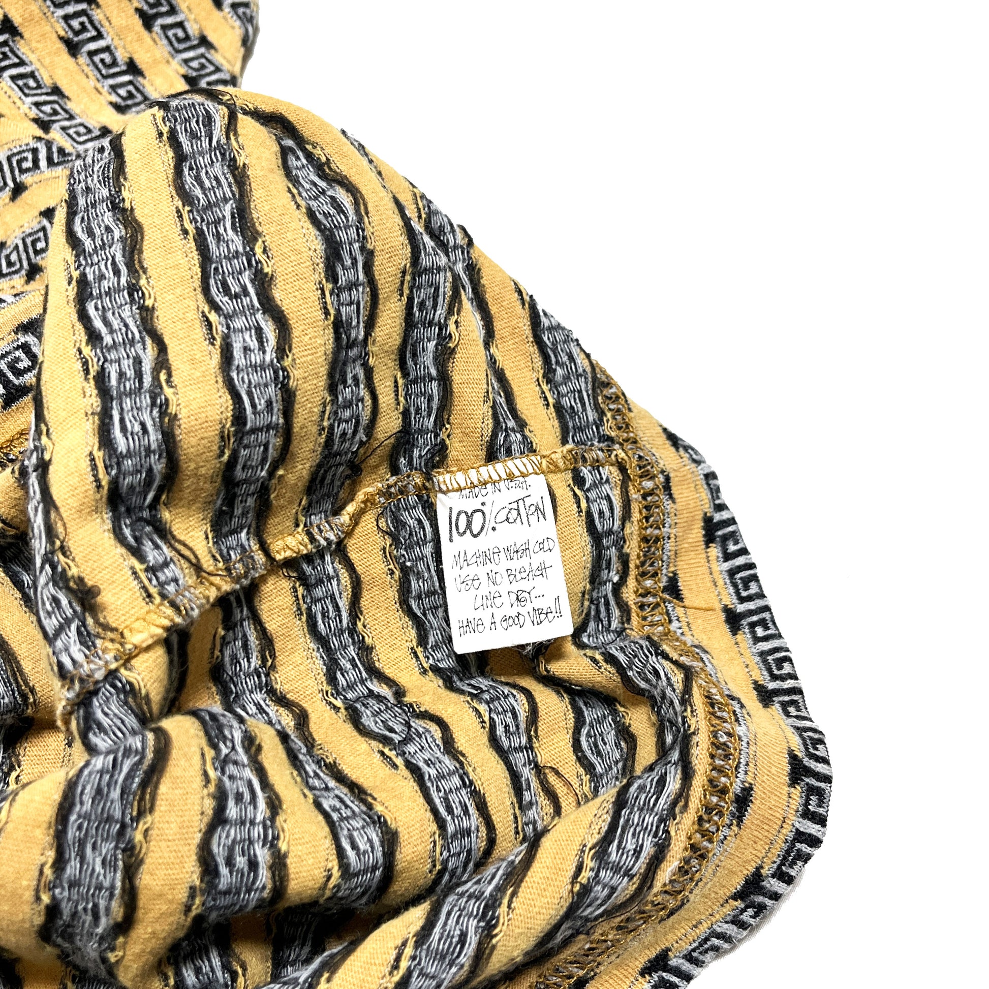 80s〜 Stussy TOM TOM Border Pocket T L ディテール 1 袖の裏面 Stussyロゴタグと黒のグリッドプリント